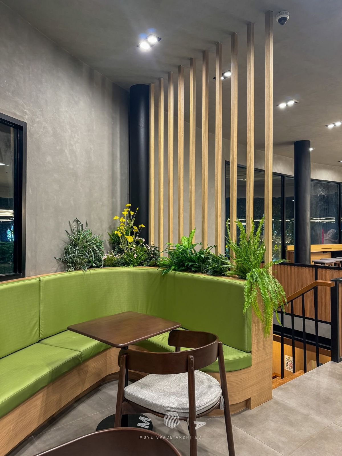 Café Amazon · Ao Noi — Banquette corner and timber screen (photograph)
